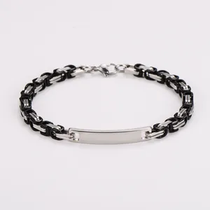 Detailed macro view of the Byzantine style stainless steel chain and polished ID plate.