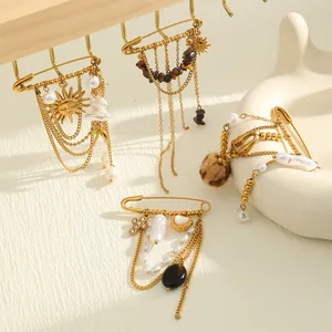 Spille vintage placcate in oro con perle barocche e nappe a forma di sole da donna.