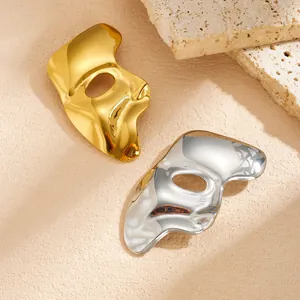 Detailed macro view of gold and silver phantom mask stainless steel brooches for clothes