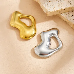 Detail view of creative abstract stainless steel brooches in gold and silver finish