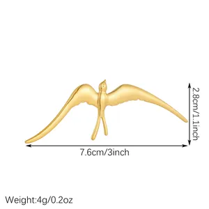 Macro detail of a golden swallow bird brooch with dimensions and weight info