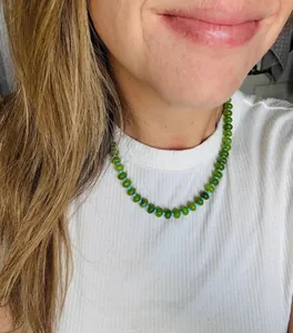 Detailed view of candy-colored green and blue natural stone abacus bead necklace on model