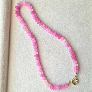 Close-up of vibrant pink natural stone abacus beads on a faceted choker necklace