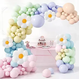 Macaron colored balloon arch kit featuring decorative white daisy flower balloons