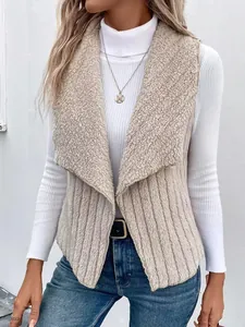 Macro detail of beige faux fur collar and ribbed texture on a stylish winter vest.
