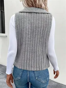 Detailed back view of a grey textured faux fur sleeveless vest for women's fall fashion.