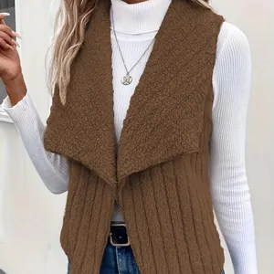Detailed macro view of brown faux shearling vest layered over a white ribbed turtleneck