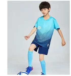 Young boy athlete modeling a professional blue gradient quick-dry soccer uniform set
