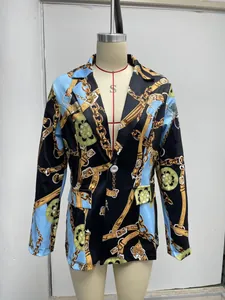 Detailed view of women's blazer featuring an intricate chain and golden buckle print
