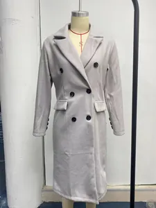 Elegant women's light grey double-breasted wool coat displayed on a mannequin stand.