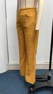 Detailed view of mustard yellow high-waisted corduroy flare pants on a mannequin.