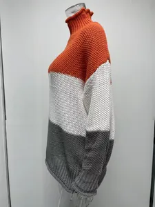 Detailed view of three-color chunky knit turtleneck sweater with textured stitch