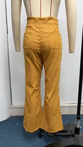 Detailed back view of mustard yellow high-waisted corduroy flare pants on a mannequin