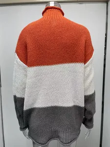 Macro view of the back of a thick knit color-block turtleneck sweater for women