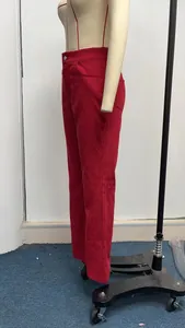 Side view of premium women's red corduroy high waisted flare trousers on mannequin