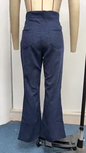 Rear view of high waisted navy corduroy flare pants on a mannequin showing pocket details