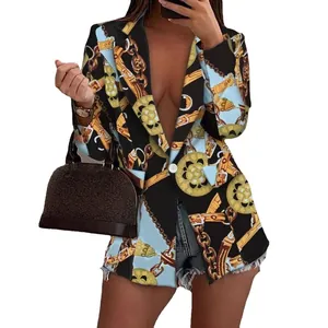 Chic women's blazer featuring vibrant gold chain and medallion prints