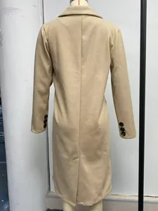 Detailed back view of a classic tan long-sleeved wool overcoat displayed on a mannequin