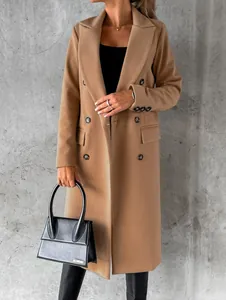 Detail shot of woman's camel wool coat with double-breasted buttons and hand-pockets.