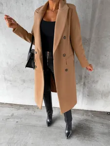 Elegant camel double-breasted wool coat featuring a long silhouette and functional pockets