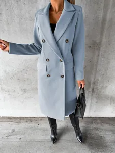 Close-up of a light blue double-breasted woolen coat featuring brown tortoiseshell buttons