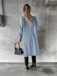 Elegant light blue long-sleeved wool coat for women featuring a stylish back slit detail