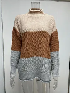 Detailed view of women's colorblock turtleneck chunky knit pullover sweater in beige brown grey