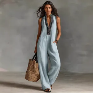 Full view of elegant sleeveless light blue linen jumpsuit with embroidered collar