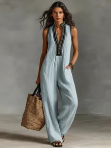 Elegant light blue linen blend sleeveless jumpsuit with embroidered stand collar