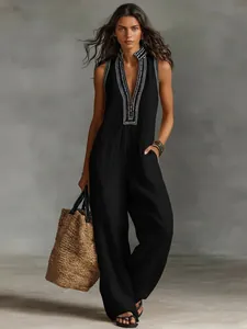Elegant black sleeveless linen blend jumpsuit with embroidered stand collar and zipper