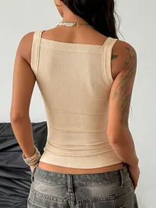 Macro detail of beige ribbed fabric on slim square neck tank top showing the back view