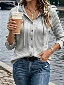 Detailed view of a grey ribbed button-down hoodie with delicate knit texture