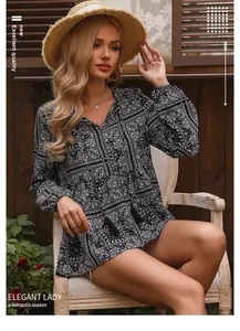 Close-up of boho chic printed blouse featuring V-neckline and tassel details on a model.