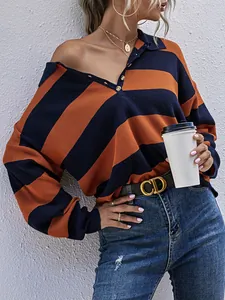 Oversized vintage navy and orange striped knit sweater with a half-placket collar on a model
