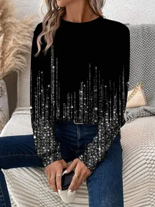 Détail d'un sweat-shirt noir à manches longues pour femmes avec imprimé pailleté.