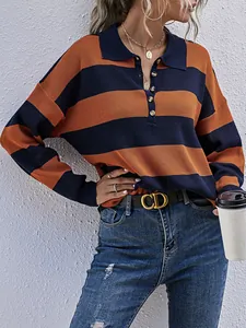 Close-up of retro orange and navy blue striped knit sweater with polo collar