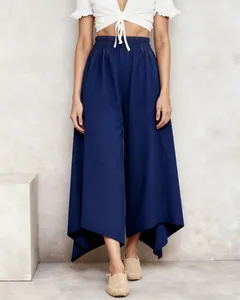 Full view of navy blue wide-leg culottes featuring an asymmetrical hem and elastic waist