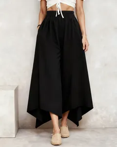 Elegant black loose-fitting midi skirt featuring an irregular hem and elastic high waist.