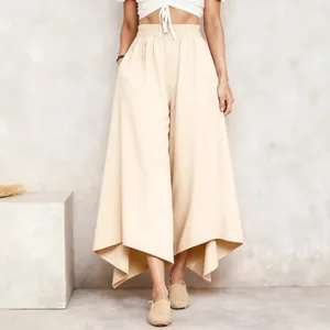 Women's minimalist high-waisted beige wide-leg trousers with an asymmetrical hem design