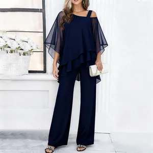 Elegant navy blue two-piece set with tiered chiffon top and wide-leg trousers