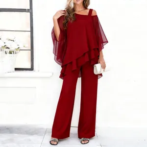 Elegant red two-piece women's outfit with asymmetric layered top and sheer chiffon sleeves