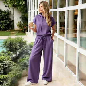 Stylish women's purple short-sleeve hoodie and wide-leg pants lounge set for casual wear