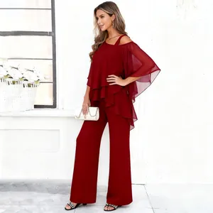 Wine red layered chiffon top and wide-leg trousers fashion two-piece set worn by model.