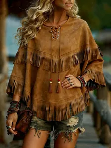 Chic brown suede poncho featuring double-layered fringe and bohemian lace-up detail.