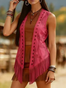 Close-up of vintage pink ethnic sleeveless vest with hollow cut-outs and long fringe.
