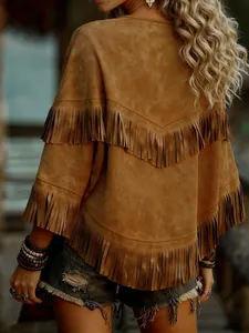 Close-up detail of a brown suede shawl with western-style fringe and batwing sleeves.