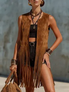 Detail view of brown suede fringe vest with bohemian tassel hem and laser-cut design