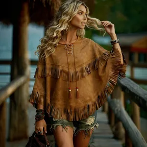 Vintage ethnic style brown suede tassel poncho with lace-up neck and batwing sleeves