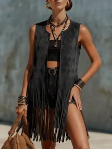 Detailed view of women's black suede fringe vest with embossed diamond pattern