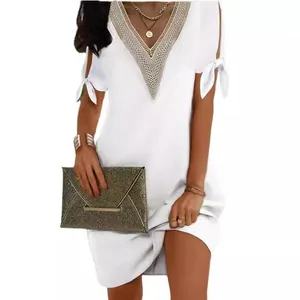 Elegant summer white mini dress featuring a lace V-neck and stylish bow-tie slit sleeves.